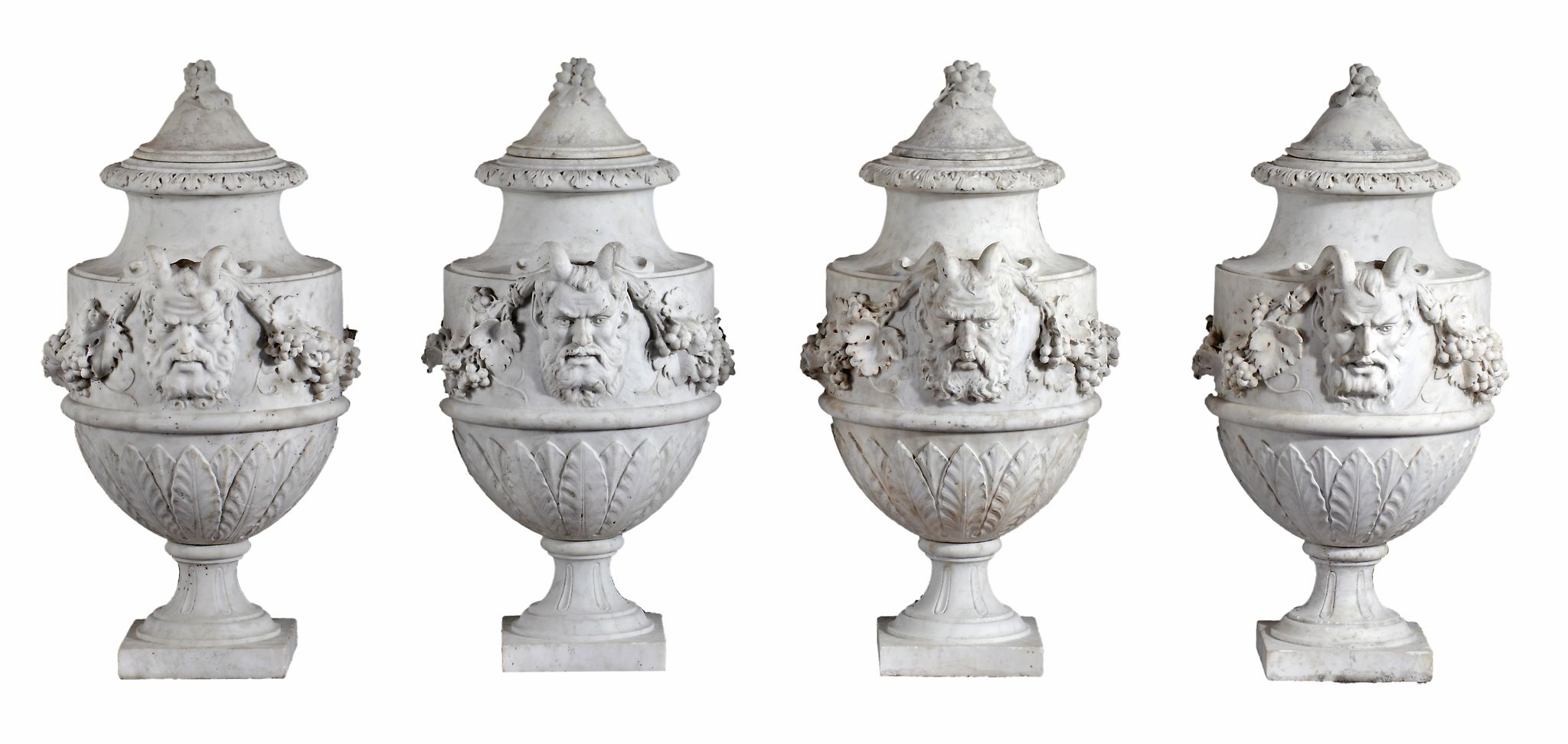 A set of four French sculpted white marble vases in Neoclassical style  A set of four French