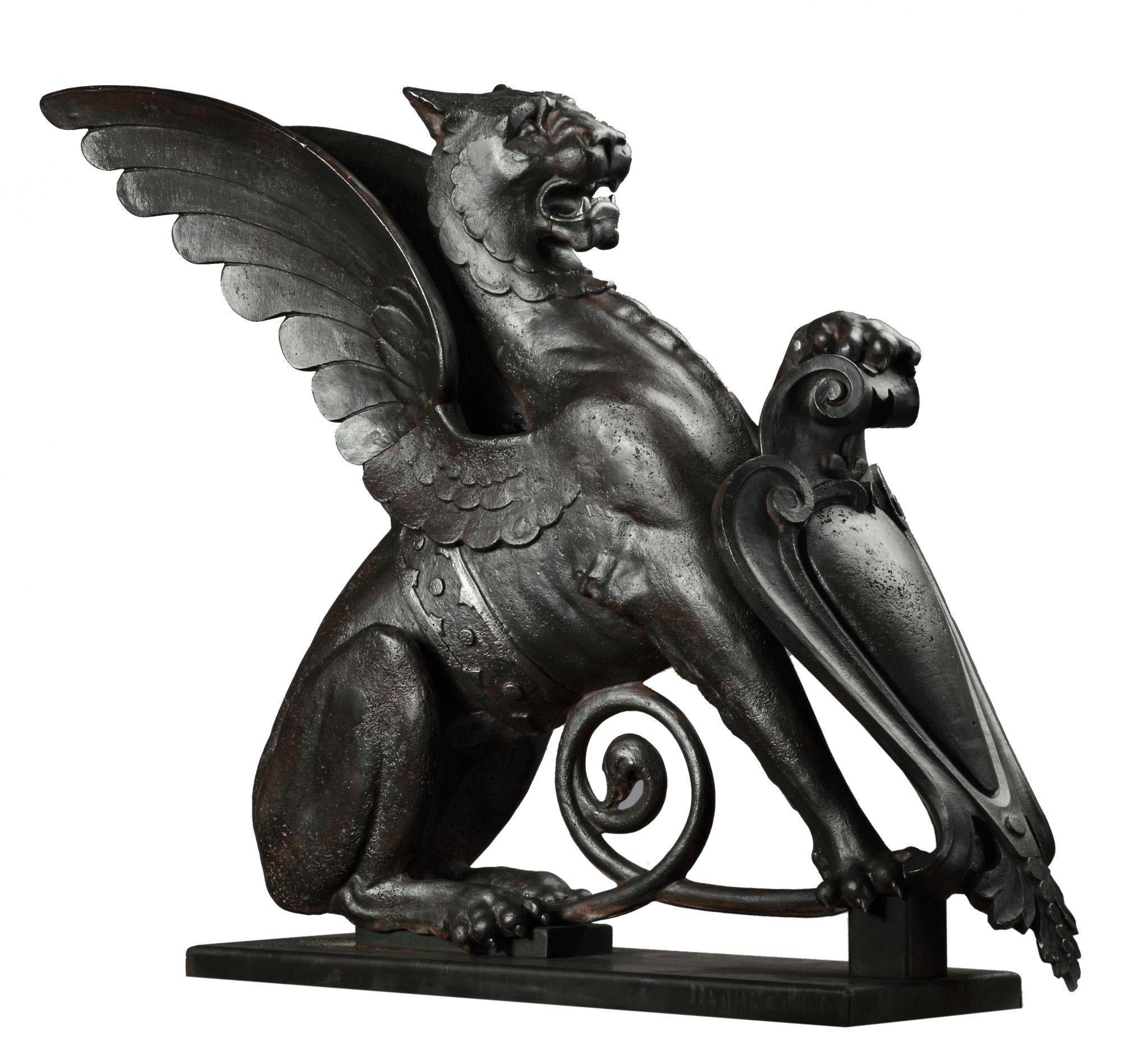 A Continental cast and wrought iron heraldic bearer modelled as a winged lion  A Continental cast