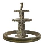 A Continental sculpted limestone three tier, figural garden fountain A Continental sculpted