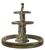 A Continental sculpted limestone three tier, figural garden fountain A Continental sculpted