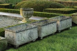A set of three Continental carved stone planters, 20th century A set of three Continental carved
