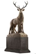 A large and impressive sculpted limestone and antler mounted model of a stag  A large and impressive