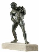 An Italian, probably Neapolitan patinated bronze model of the Faun with a...  An Italian, probably