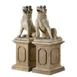 A pair of sculpted marble models of Molossian guard dogs  A pair of sculpted marble models of