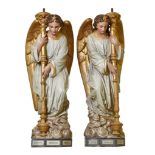 A pair of French polychrome decorated sculpted terracotta figural torcheres...  A pair of French
