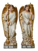 A pair of French polychrome decorated sculpted terracotta figural torcheres...  A pair of French