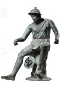 A Neapolitan verdigris patinated bronze model of a fisherman  A Neapolitan verdigris patinated