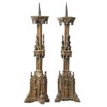 A pair of Continental, probably French gilt cast iron pricket candlesticks...  A pair of