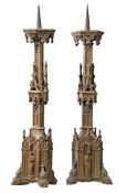 A pair of Continental, probably French gilt cast iron pricket candlesticks...  A pair of