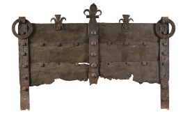 An extremely rare French wrought iron fireback, early 16th century  An extremely rare French wrought