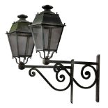 A pair of painted zinc, glazed and wrought iron wall lanterns, circa 1900  A pair of painted zinc,