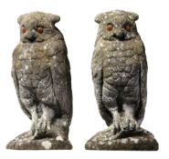 A pair of stone composition finials modelled as owls, early 20th century  A pair of stone