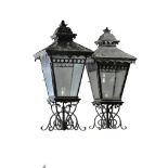 A pair of large wrought iron and glazed pier lanterns  A pair of large wrought iron and glazed