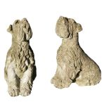 A pair of stone composition garden models of terriers , 20th century  A pair of stone composition