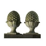 A pair of carved limestone pinecone finials, 20th century  A pair of carved limestone pinecone
