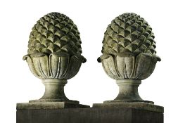 A pair of carved limestone pinecone finials, 20th century  A pair of carved limestone pinecone