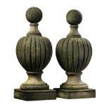 A pair of carved limestone pier finials, 20th century  A pair of carved limestone pier finials,