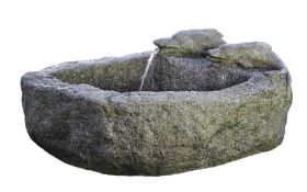 A Continental rough hewn granite basin, 18th/19th century, of segmental section  A Continental rough