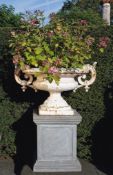 A French white painted cast iron twin handled urn  A French white painted cast iron twin handled