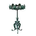 A Continental green painted cast iron jardiniere stand  A Continental green painted cast iron