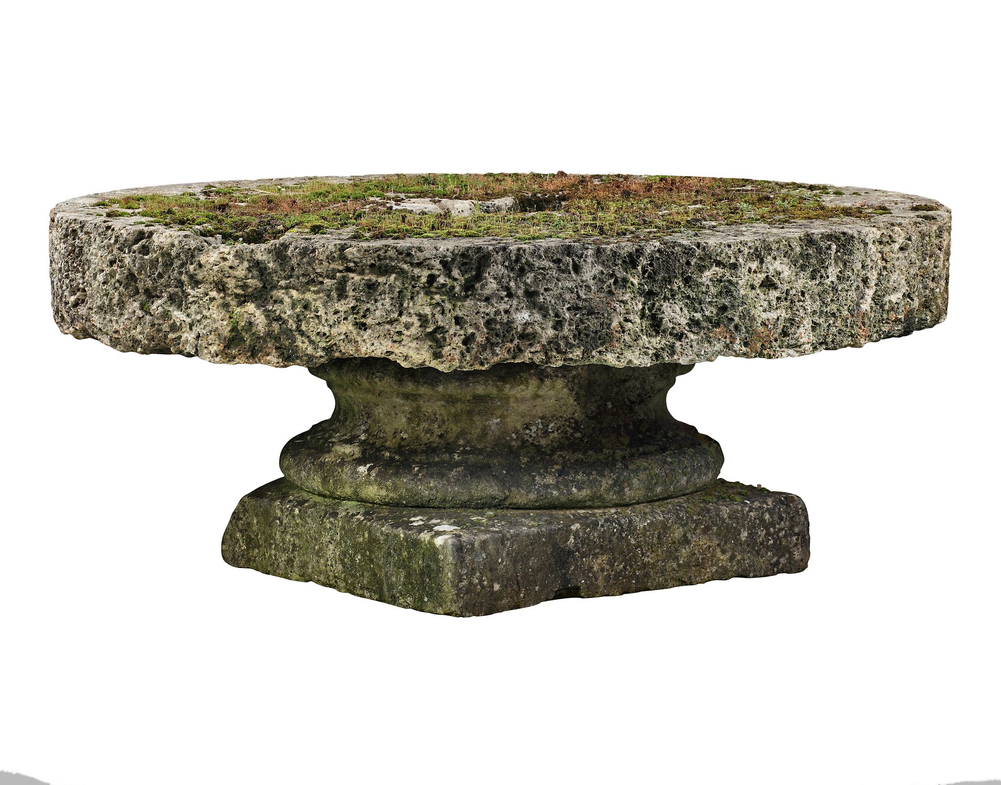 A French rough hewn circular millstone mounted onto an associated limestone...  A French rough