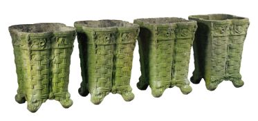 A set of four Continental stone composition planters in the form of baskets  A set of four