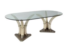 A glass topped, resinous faux ivory and metal mounted dining table  A glass topped, resinous faux