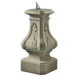 A Continental carved grey stone and bronze mounted sundial, early 20th century  A Continental carved
