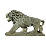 A pair of sculpted limestone models of walking lions, 20th century  A pair of sculpted limestone
