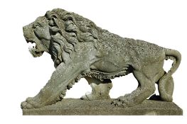 A pair of sculpted limestone models of walking lions, 20th century  A pair of sculpted limestone