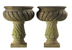 A pair of Continental carved limestone garden urns, 20th century  A pair of Continental carved