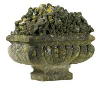 A sculpted limestone garden model of a flower urn, late 19th century  A sculpted limestone garden