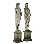 A pair of stone composition models of maidens, early 20th century  A pair of stone composition