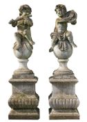 A pair of sculpted limestone models of musical putti , 20th century  A pair of sculpted limestone