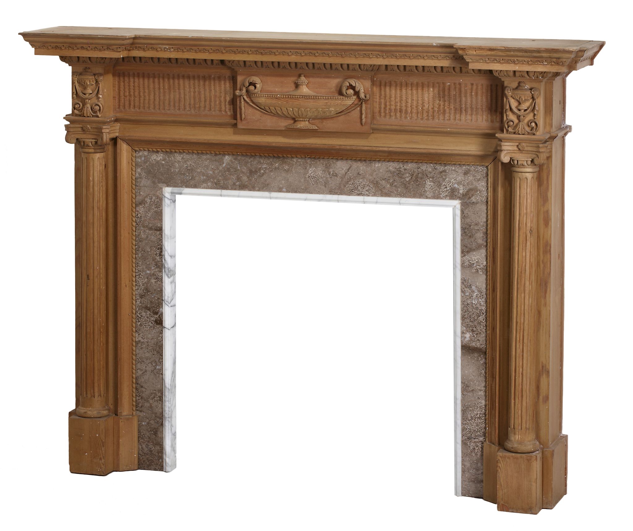 A carved pine chimneypiece in Neoclassical style, 19th century  A carved pine chimneypiece in
