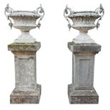 A large pair of French white painted cast iron twin handled urns, 19th century A large pair of