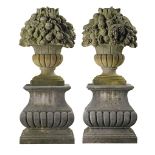 A pair of large carved limestone models of fruit baskets, probably French A pair of large carved