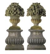 A pair of large carved limestone models of fruit baskets, probably French A pair of large carved