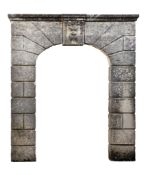 A Continental ashlar carved limestone archway, 19th century  A Continental ashlar carved limestone