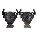 A pair of French cast iron vases after Calla's bronze urn at Versailles  A pair of French cast