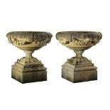 A pair of large Continental carved limestone garden urns, 20th century  A pair of large