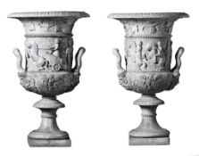A pair of monumental Italian sculpted white marble urns in the manner of the...  A pair of