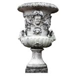 A Continental stone composition garden urn on a stone composition pedestal  A Continental stone