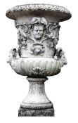 A Continental stone composition garden urn on a stone composition pedestal  A Continental stone