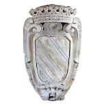 An Italian carved Carrara marble wall mounting armorial panel, 17th century  An Italian carved