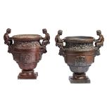 A pair of French cast iron vases after Calla's bronze urn at Versailles  A pair of French cast