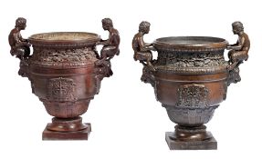 A pair of French cast iron vases after Calla's bronze urn at Versailles  A pair of French cast