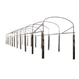 A wrought iron and oak mounted pathway bower frame  A wrought iron and oak mounted pathway bower