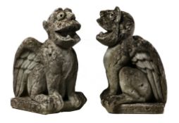 A pair of sculpted limestone winged gargoyles in Mediaeval style, 19th century  A pair of sculpted