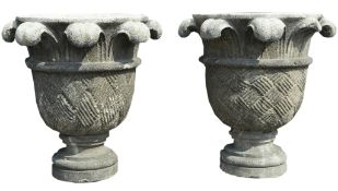 A pair of Continental carved limestone planters, 20th century, of circular form  A pair of